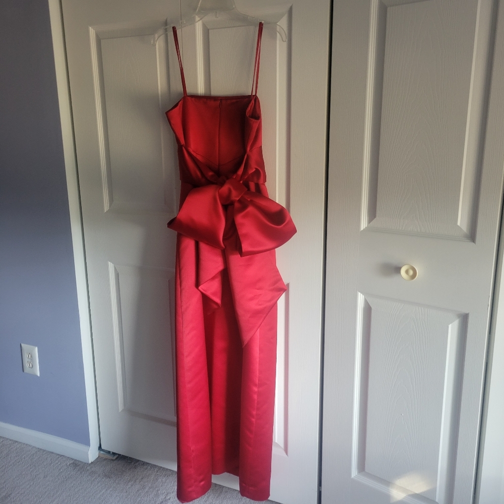 Beautiful red satin gown with bow in back, size 8